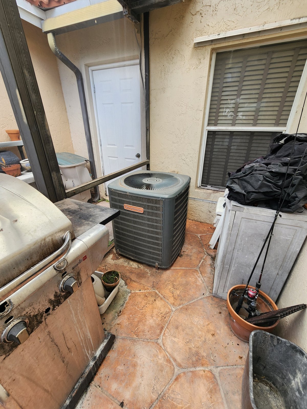 986 SW 180th Ter — AC condenser at the patio corner